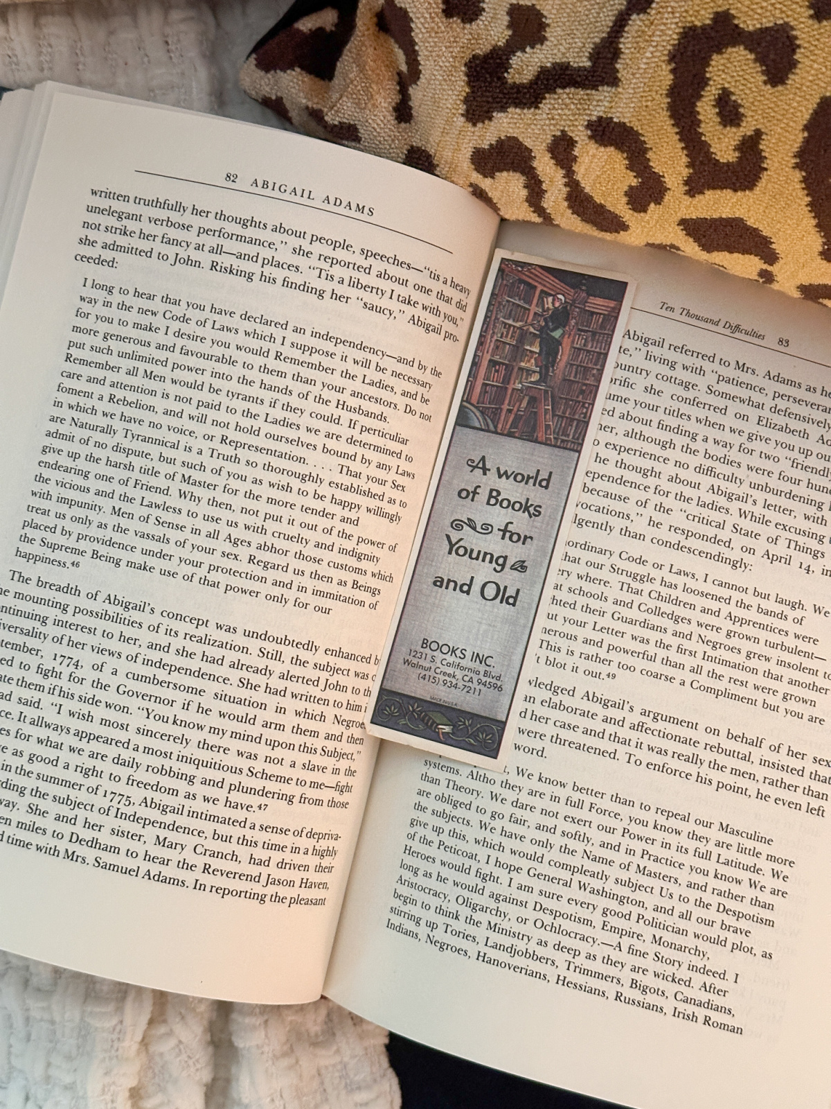 Open book with bookmark in center.