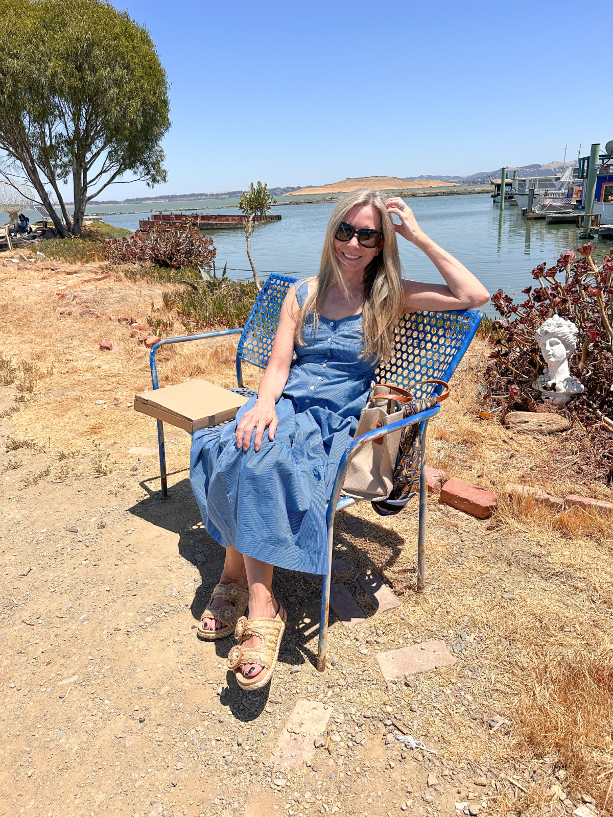 Woman sitting on beach at Point San Pablo Harbor.