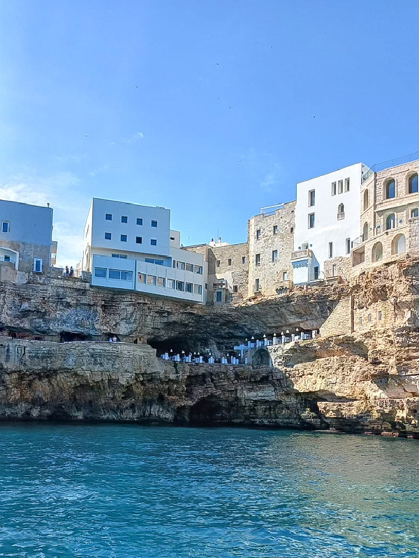 Looking up at Grotta Palazzese from Catamaran on Adriatic.