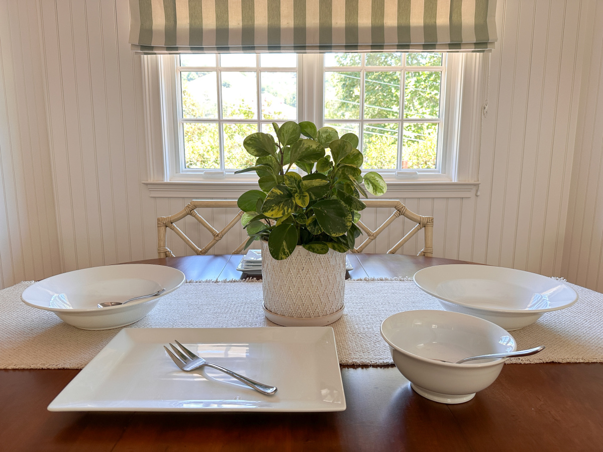Empty platters set out on table for buffet.