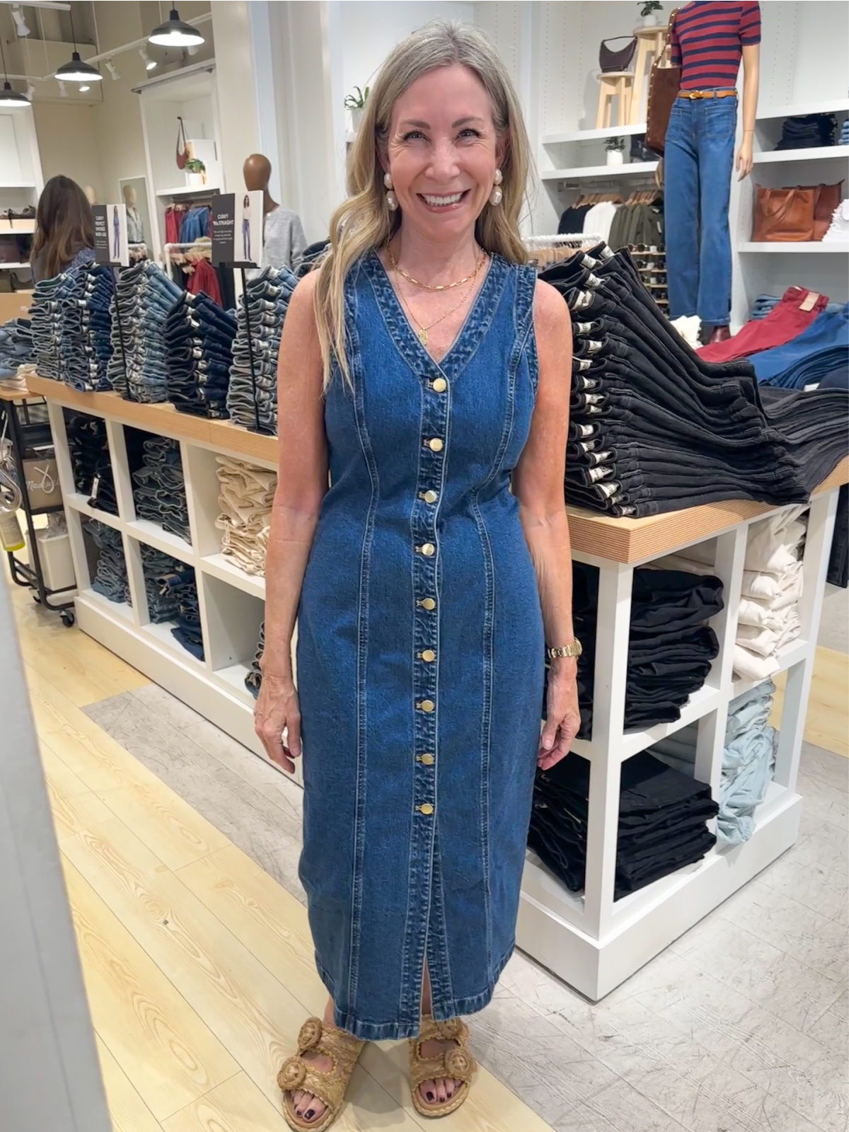 Woman wearing Madewell denim dress.