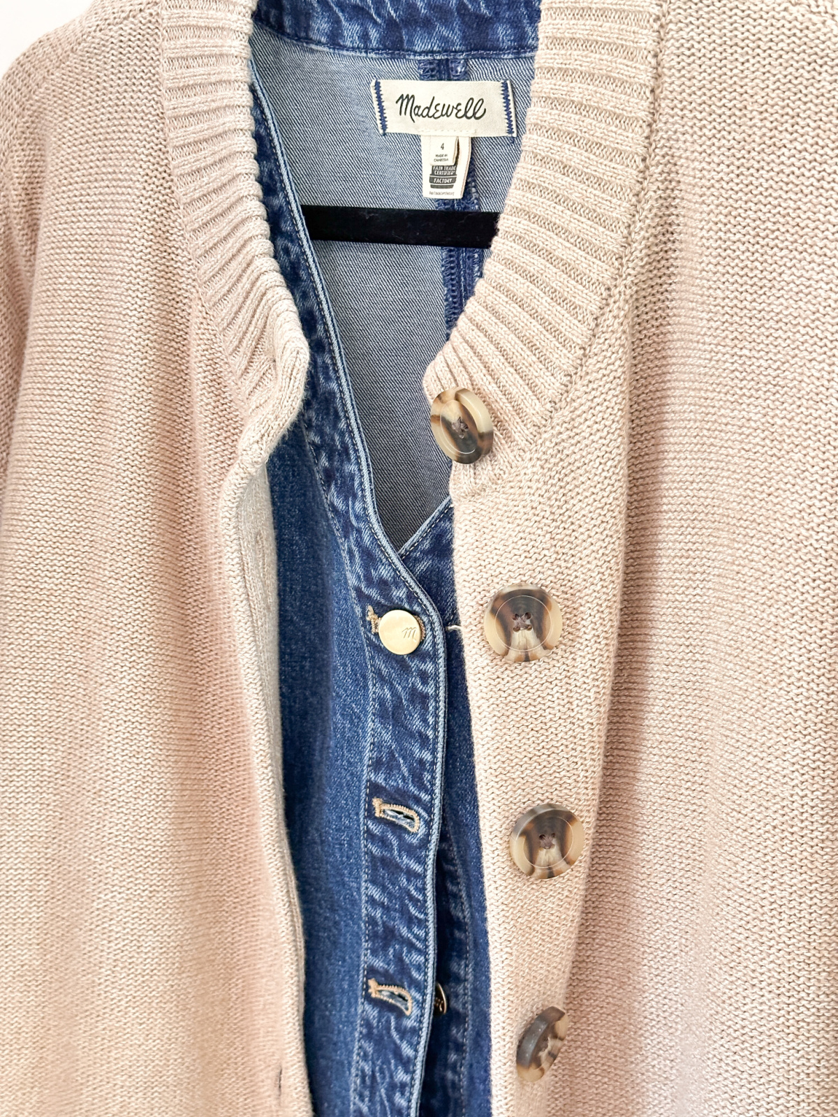 Beige cotton cardigan over denim dress.