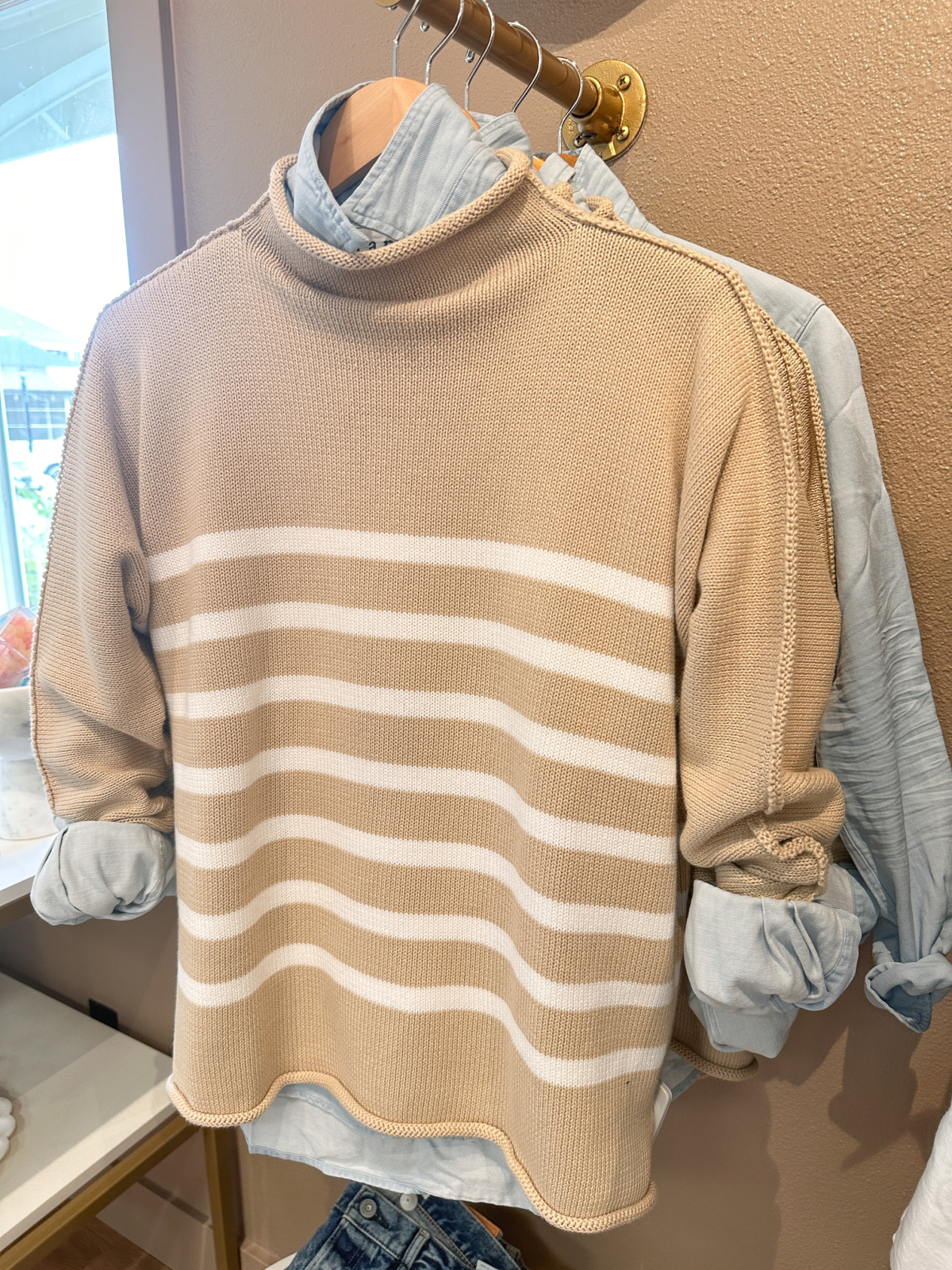 Striped sweater and button down shirts at Flaunt boutique.