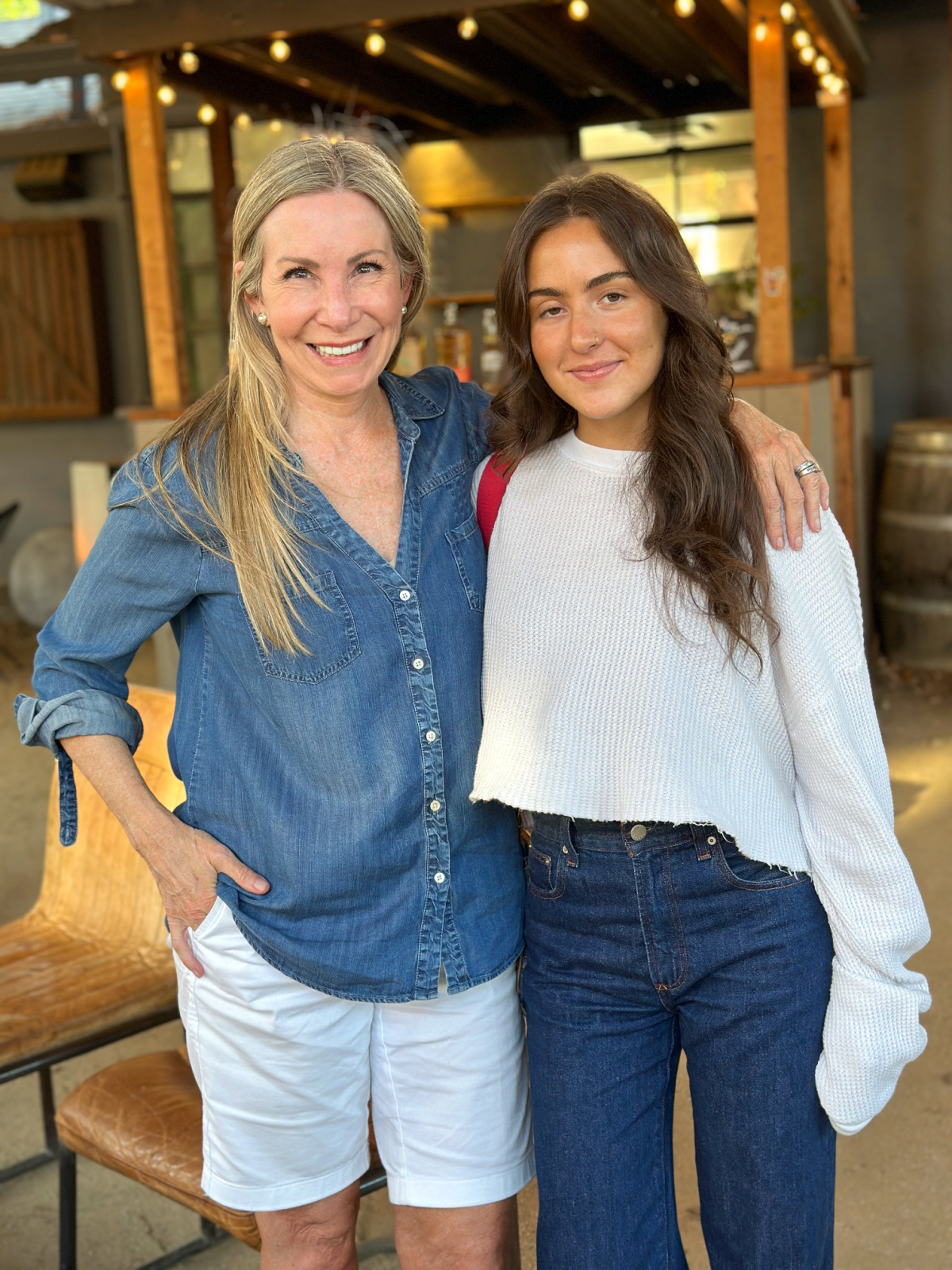 Woman and niece at outdoor restaurant.