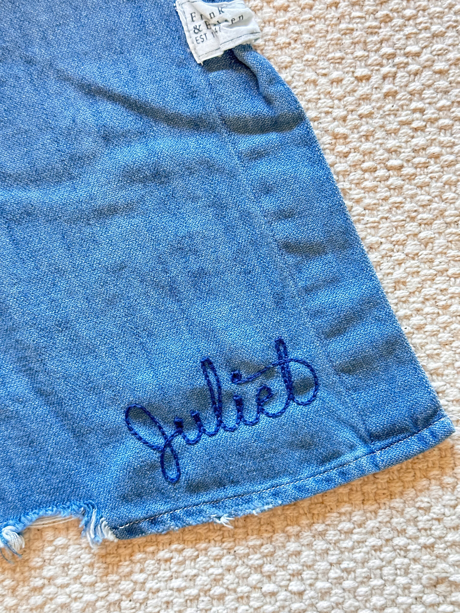 Embroidered shirt hem.