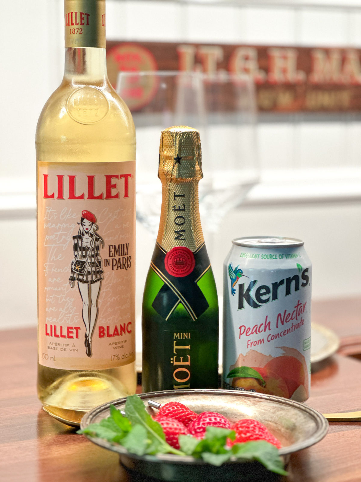 Emily in Paris Lillet bottle, Moet and peach nectar.