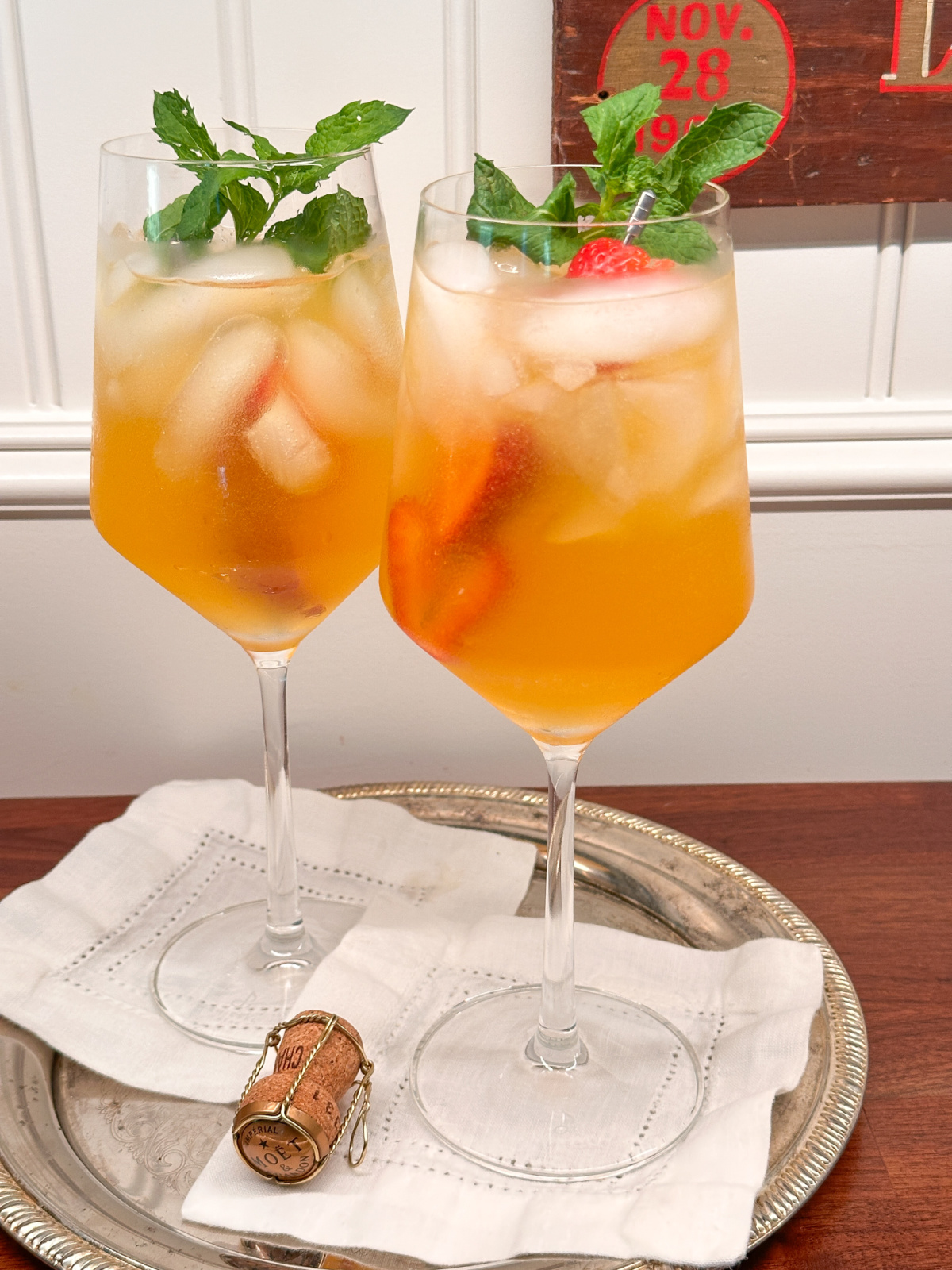 Two glasses of Emily Lillet Royale on silver tray.