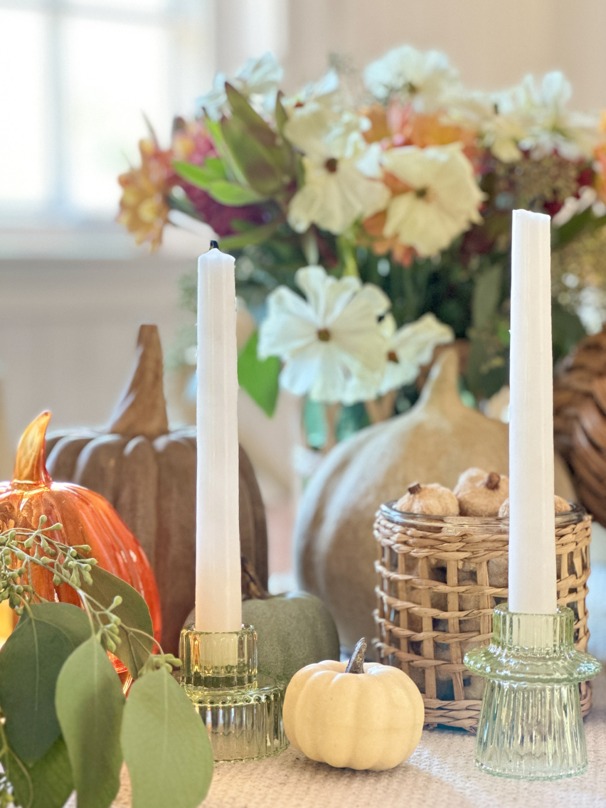 Green Glass Candle stick holders on fall table setting.