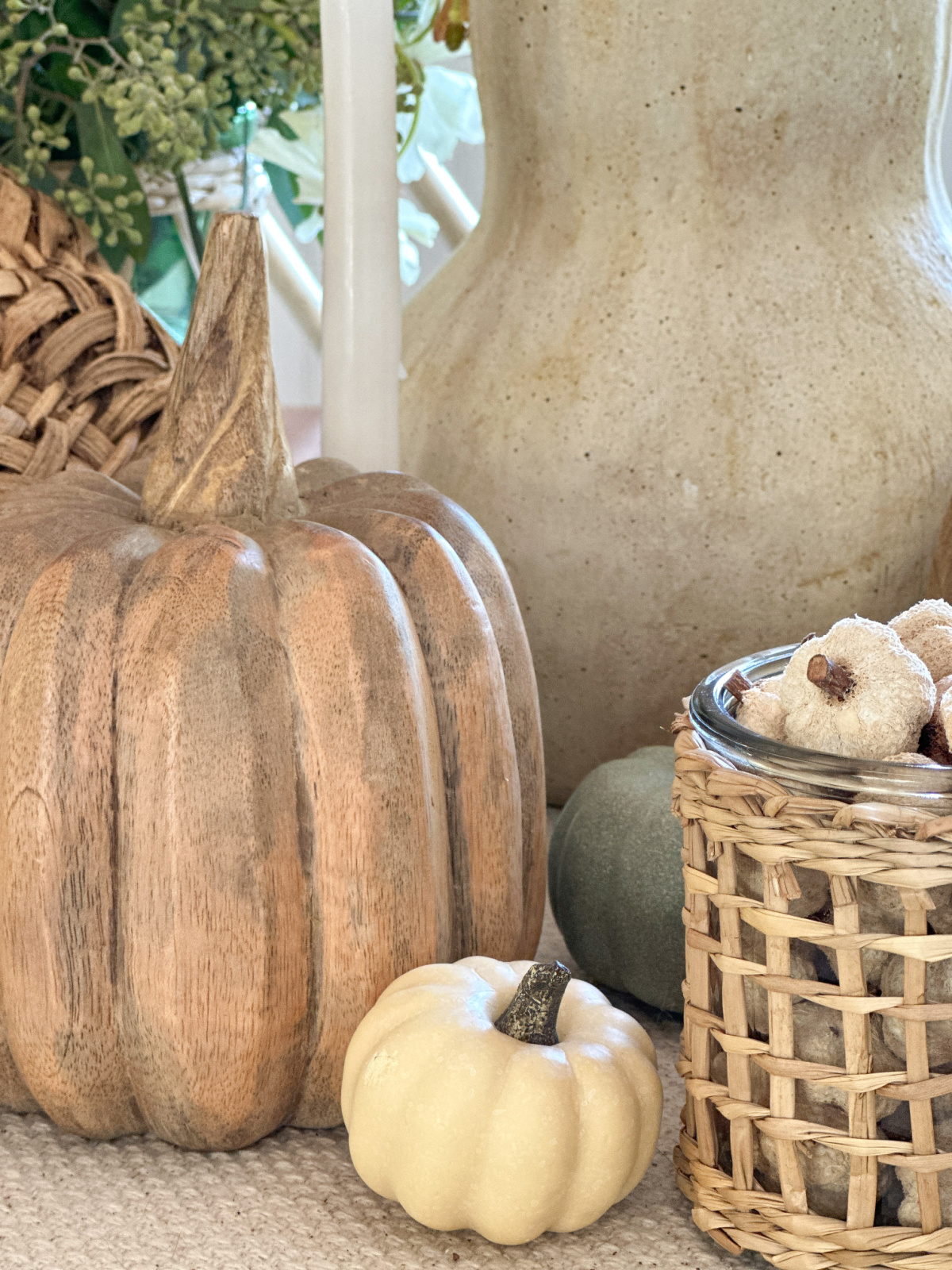 Pumpkins and gourds on fall table.