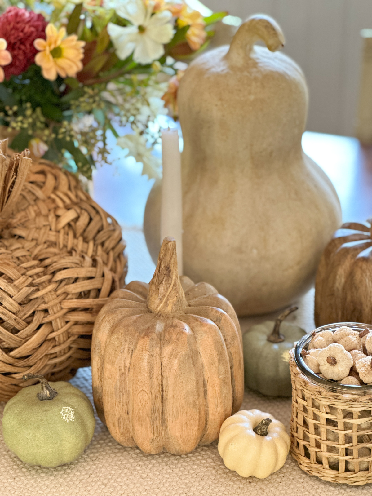 Pumpkins and gourds on fall table.