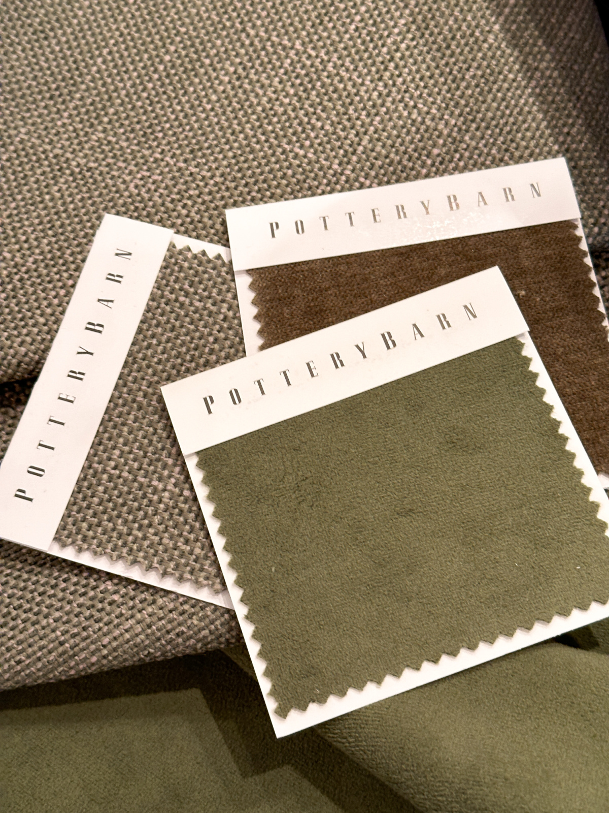 Pottery Barn green fabric swatches.