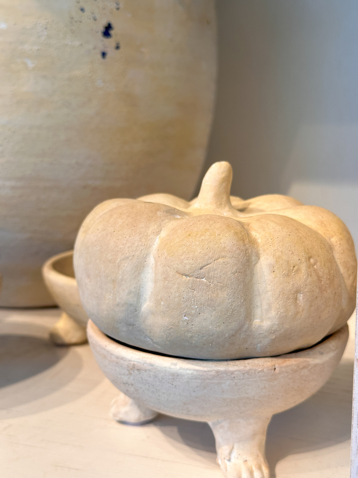 Terracotta mini pumpkin in bowl at Pottery Barn.