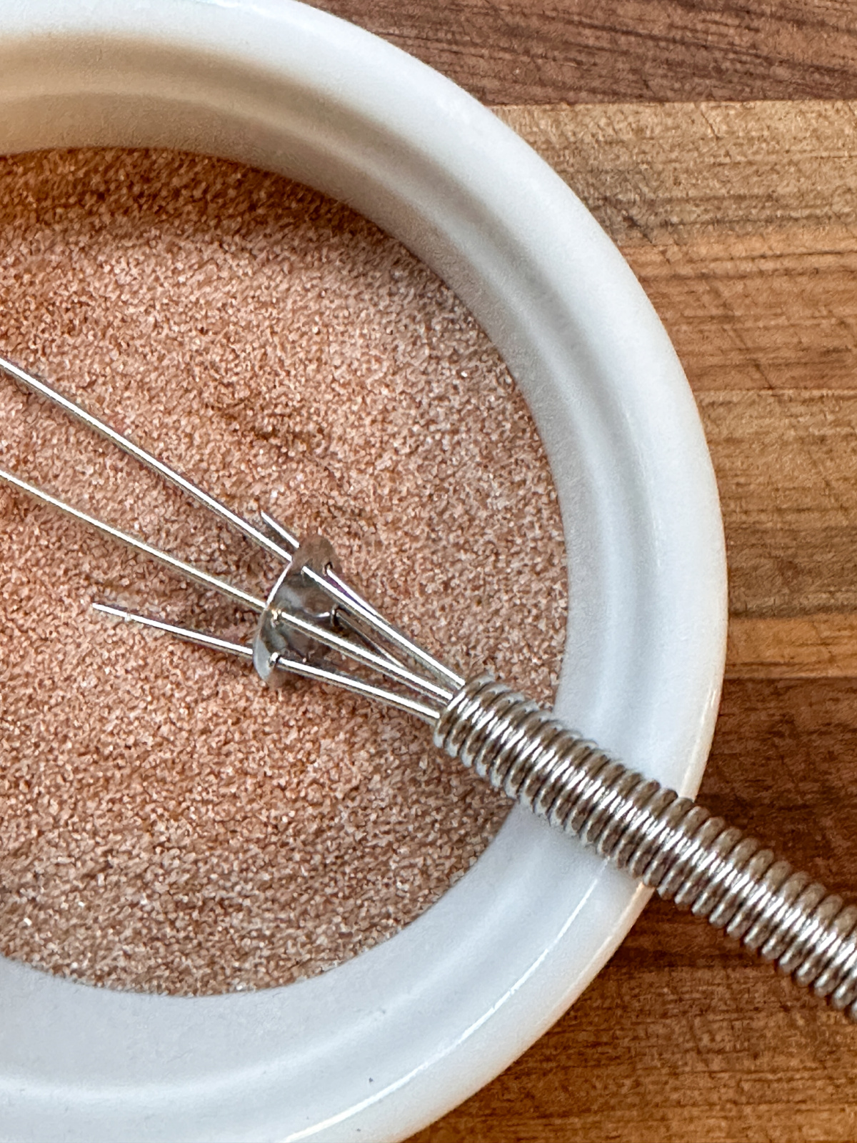Overhead shot of cinnamon sugar in ramekin.