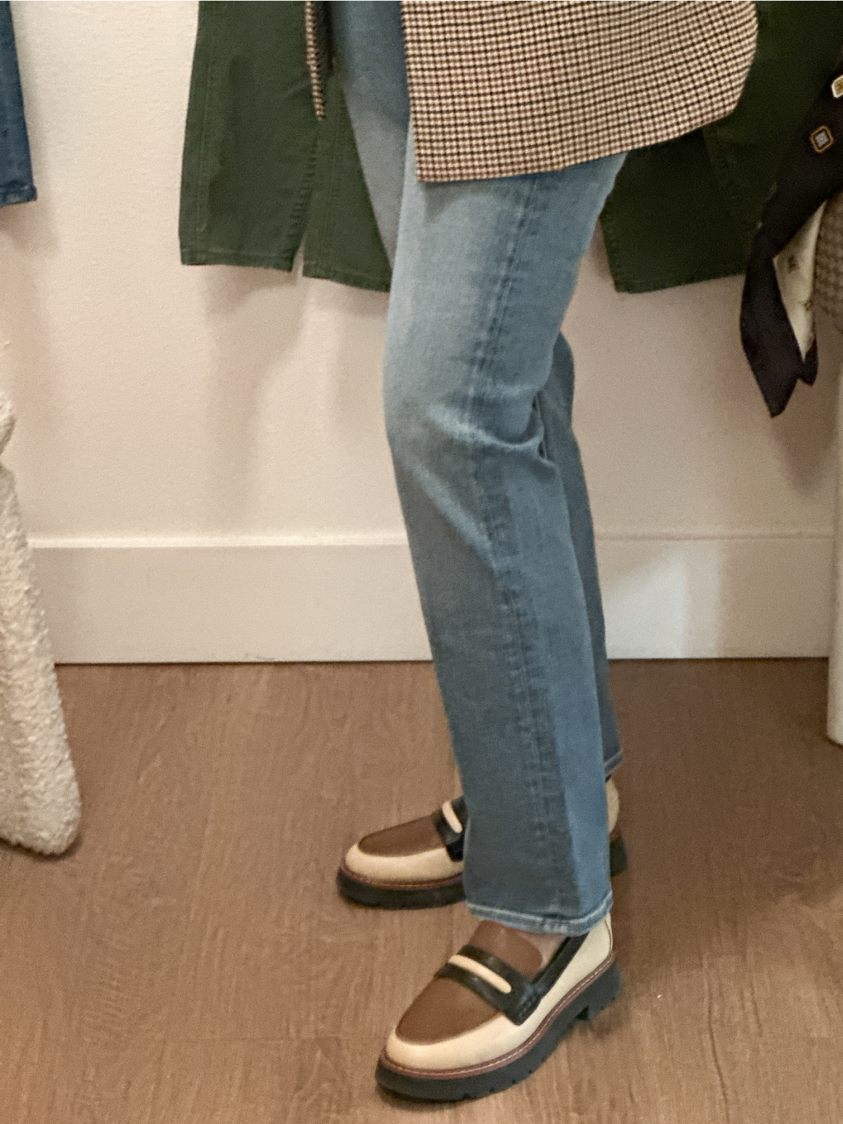 Woman trying on Mother Denim.
