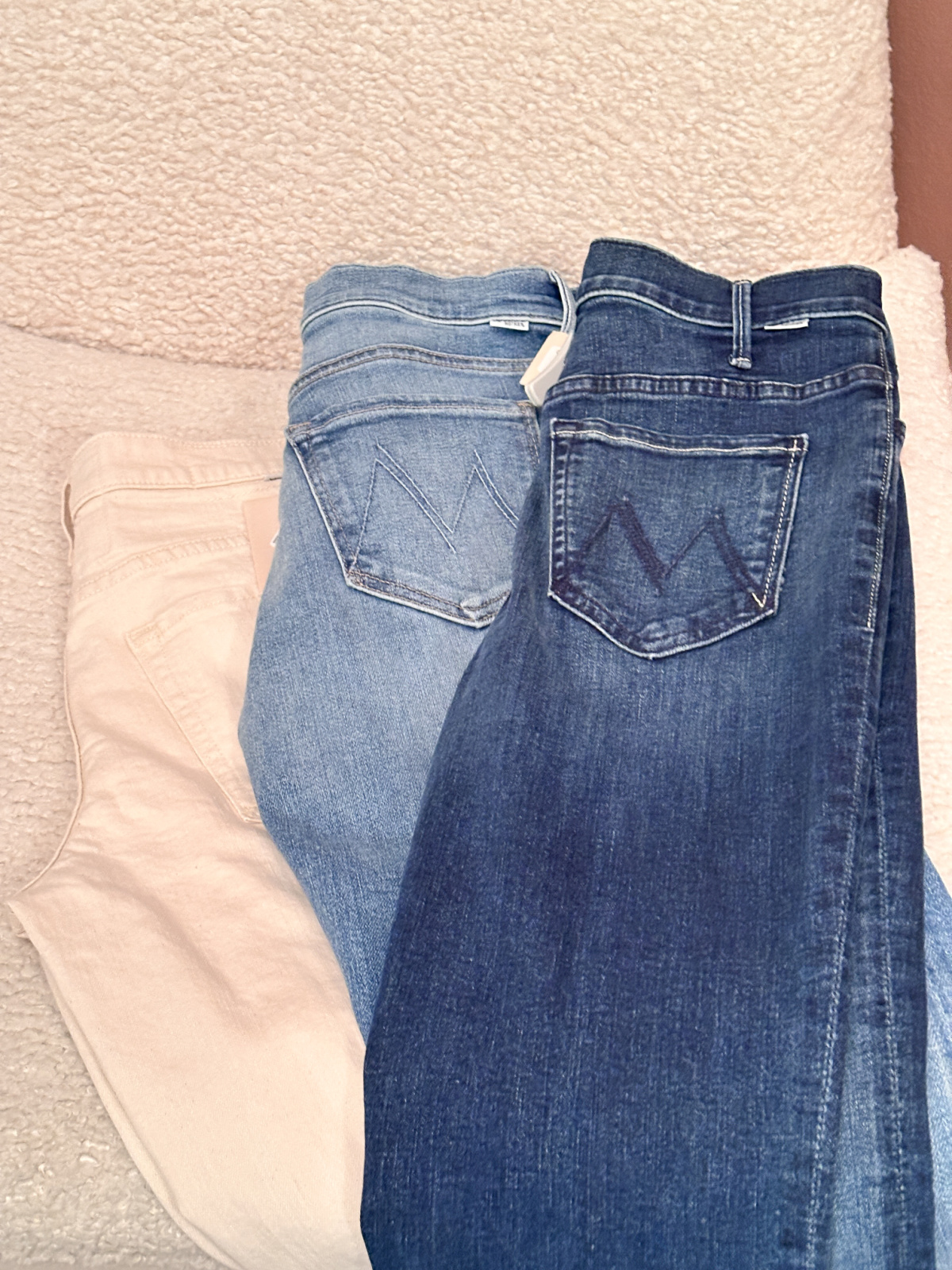 Mother Denim laid out in dressing room.