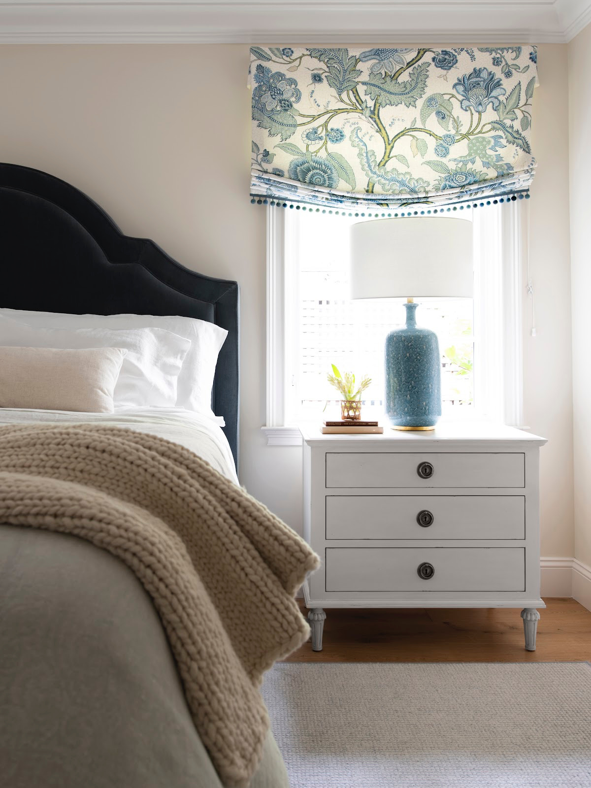 Image of bed and nightstand.