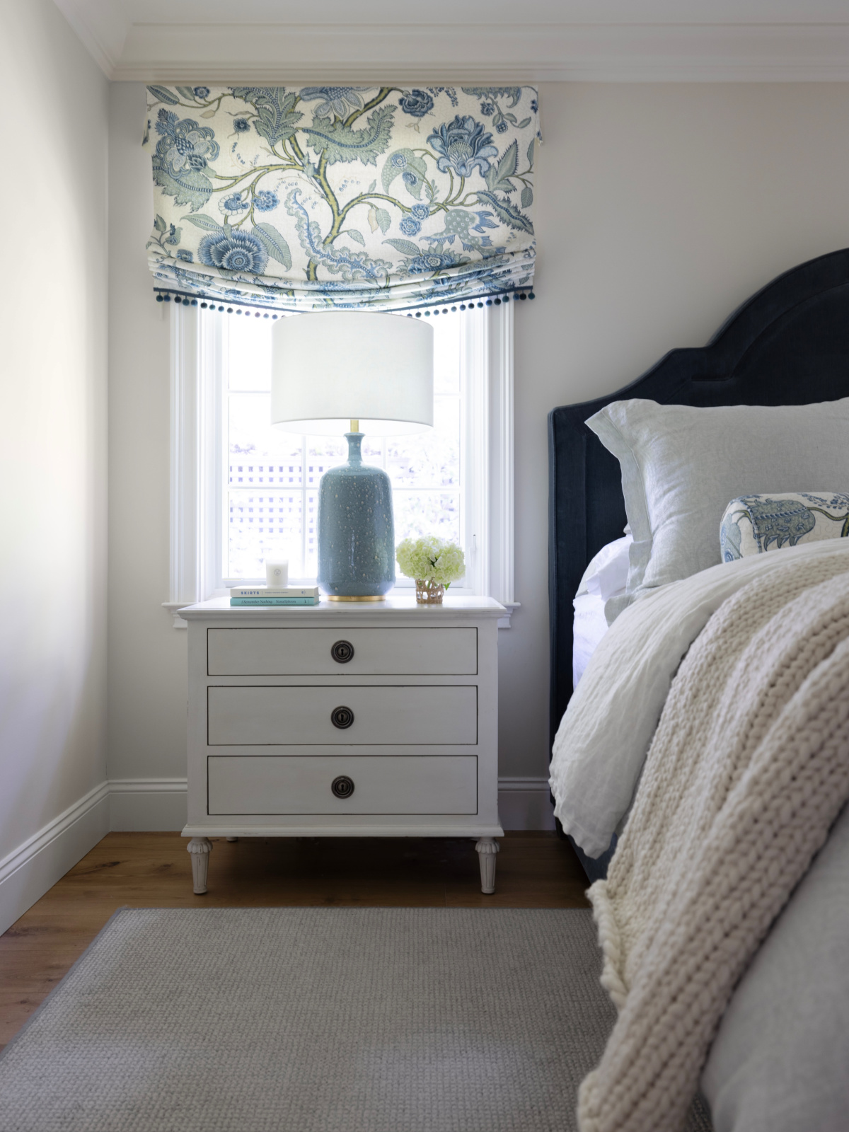 Image of bed and nightstand.