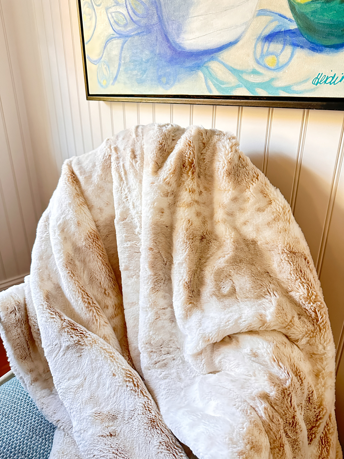 Large XO The Blanket thrown over chair.