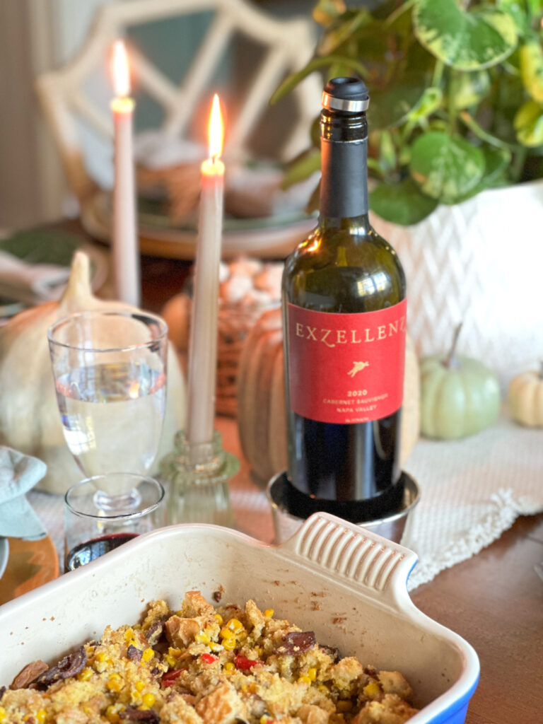 Dish of dressing sitting on Thanksgiving table.