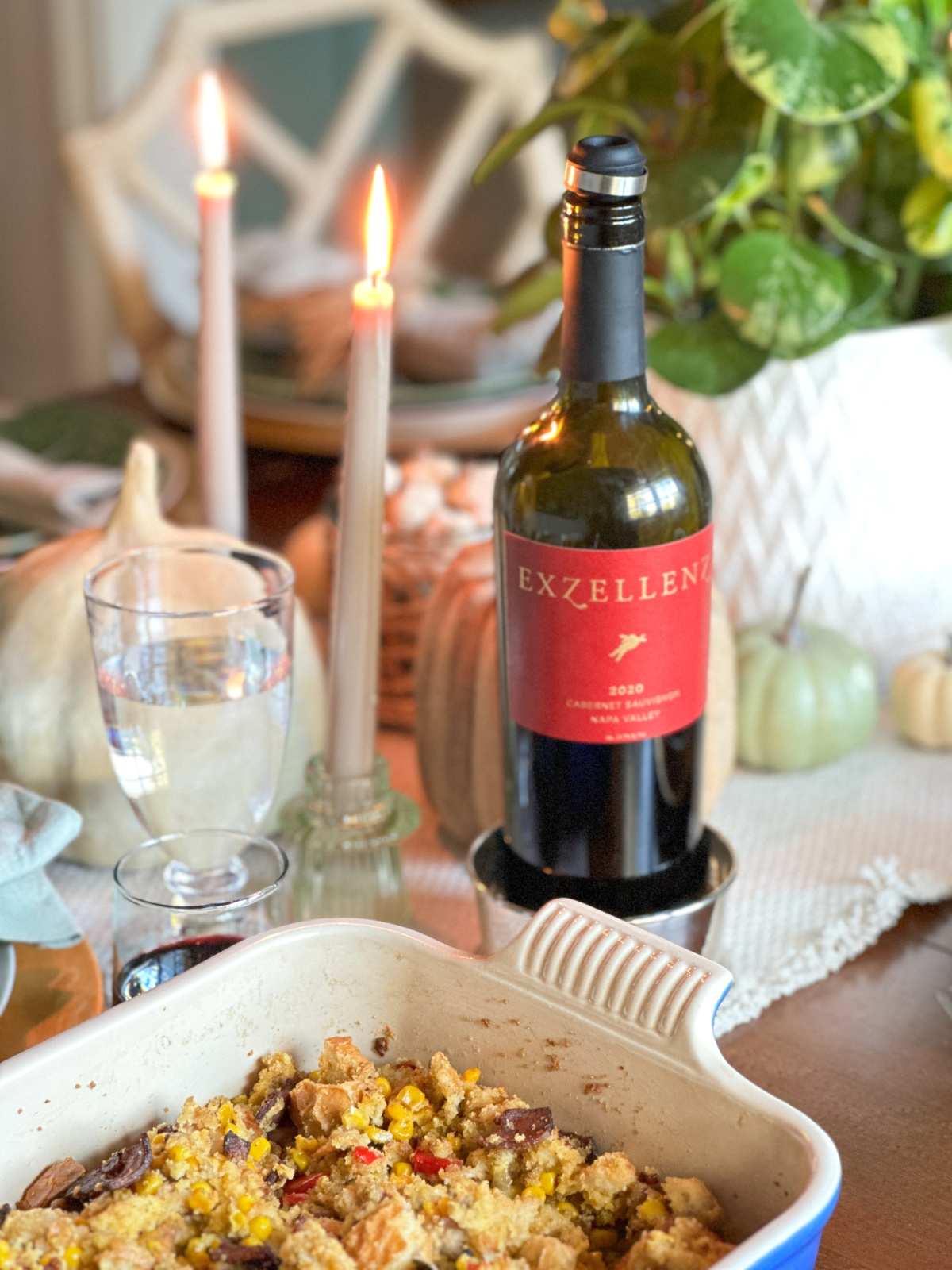 Dish of dressing sitting on Thanksgiving table.