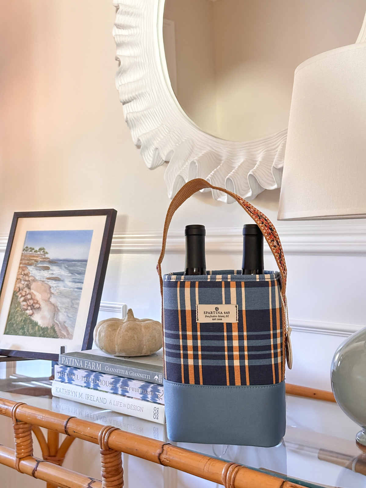 Plaid wine caddy from Spartina 449 on foyer table.