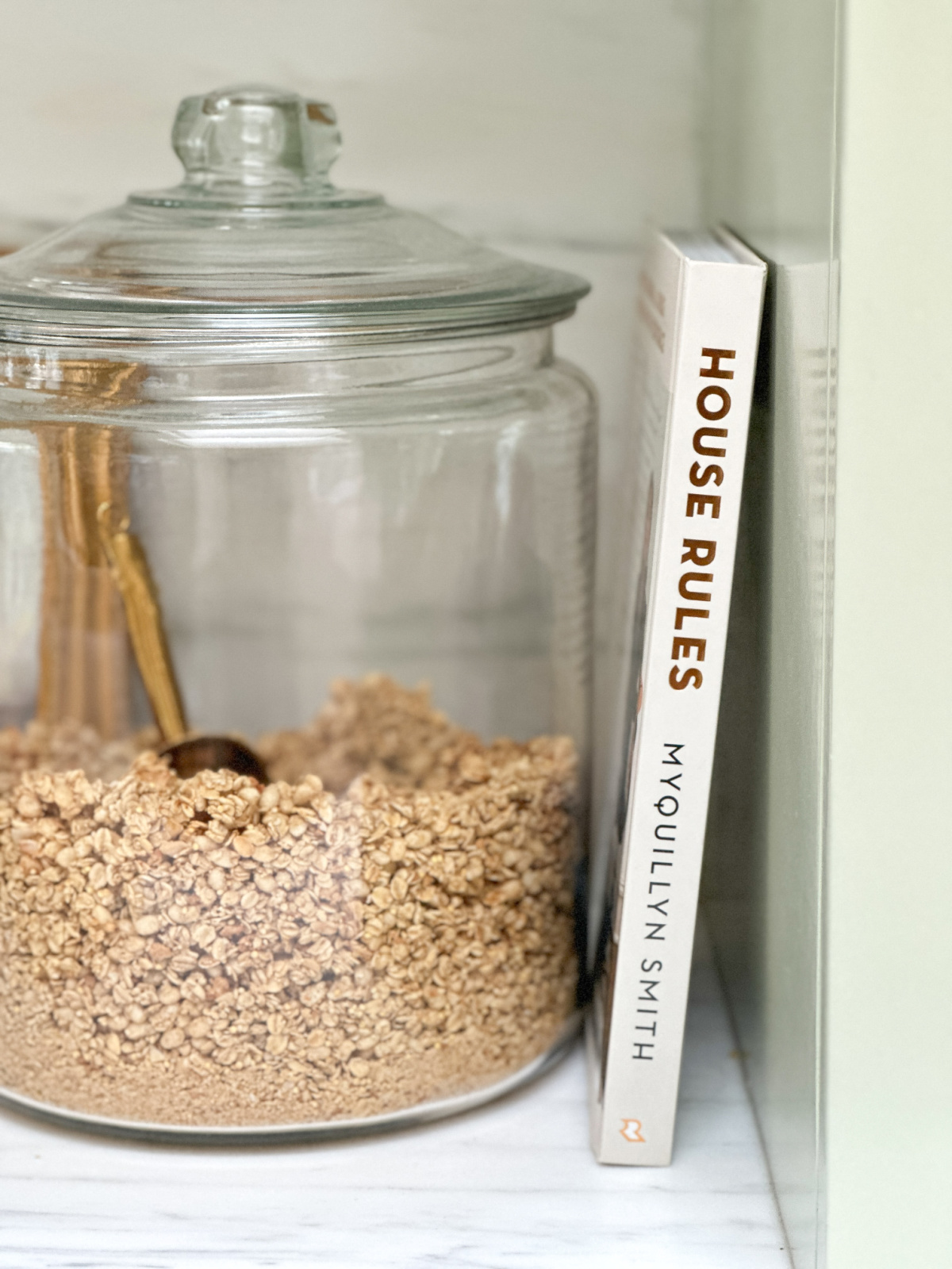 House Rules book propped up next to jar of granola.