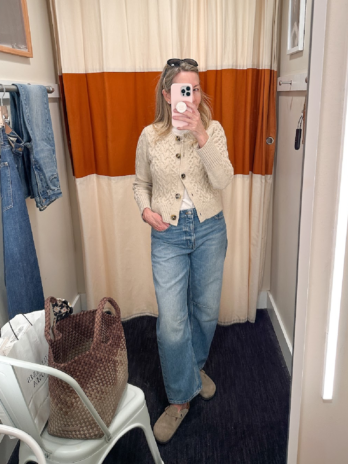 Woman taking dressing room selfie at Madewell.