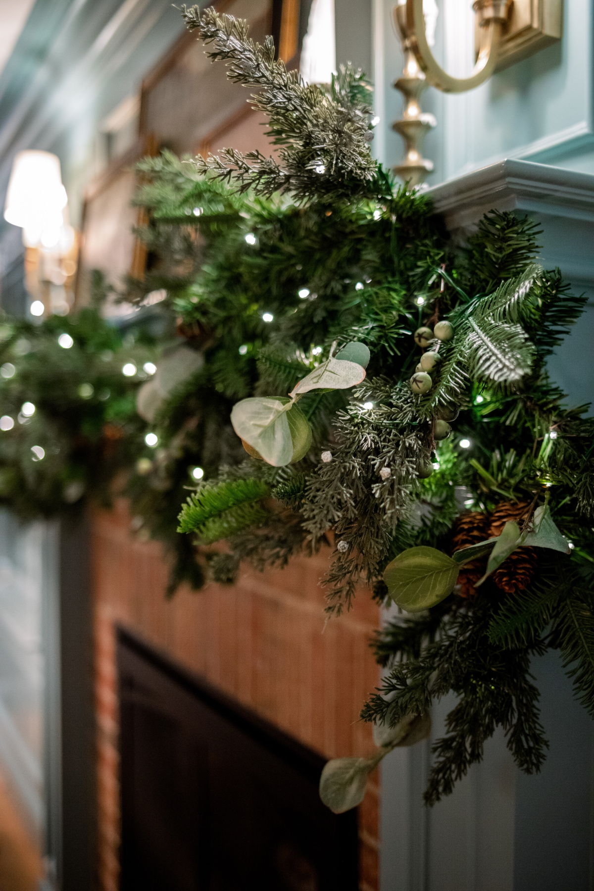 Lit garland on fireplace mantel.