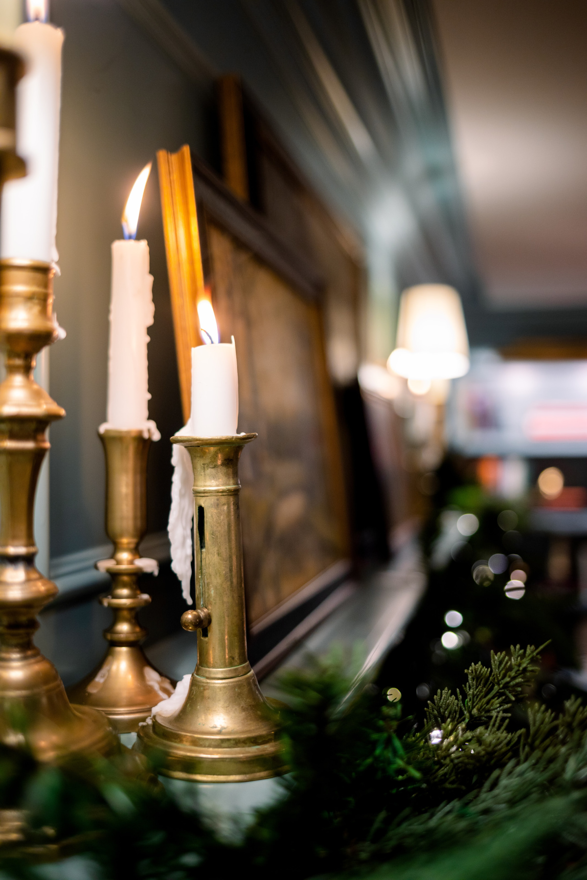 Brass candlesticks on mantle.