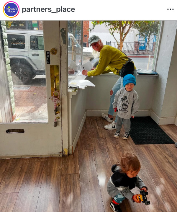 Woman and her grandsons working to prepare new pet shop for opening, Pet provisions in Martinez, CA.