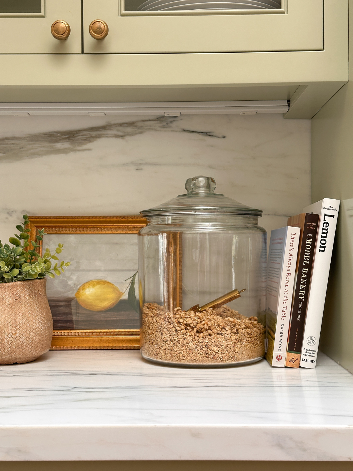 Three cookbooks on kitchen counter.