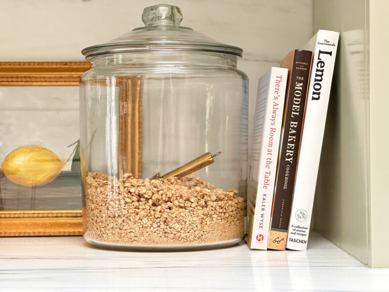 Cookbooks leaning on kitchen counter.