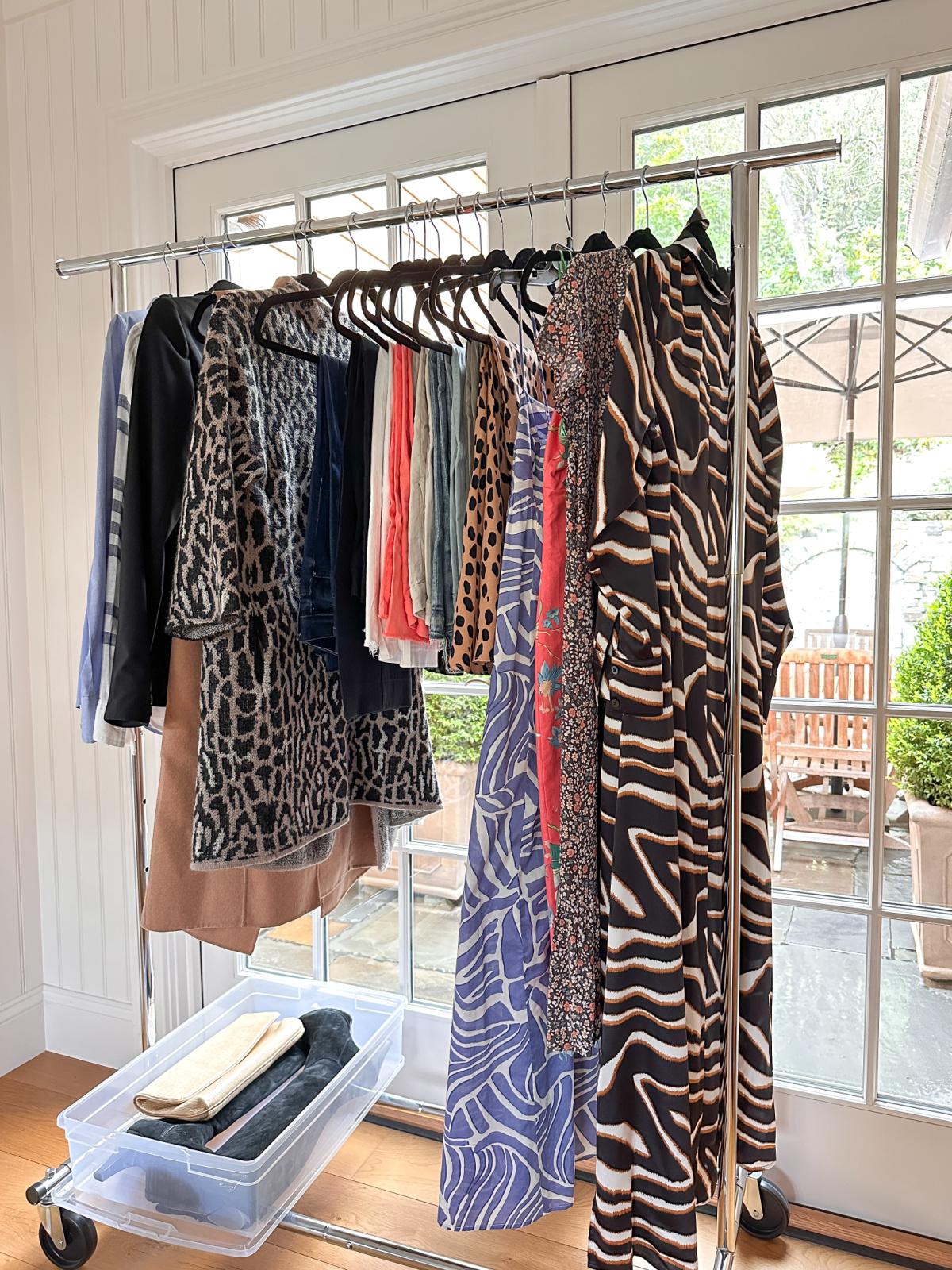 Rack of clothes to be posted on Poshmark.