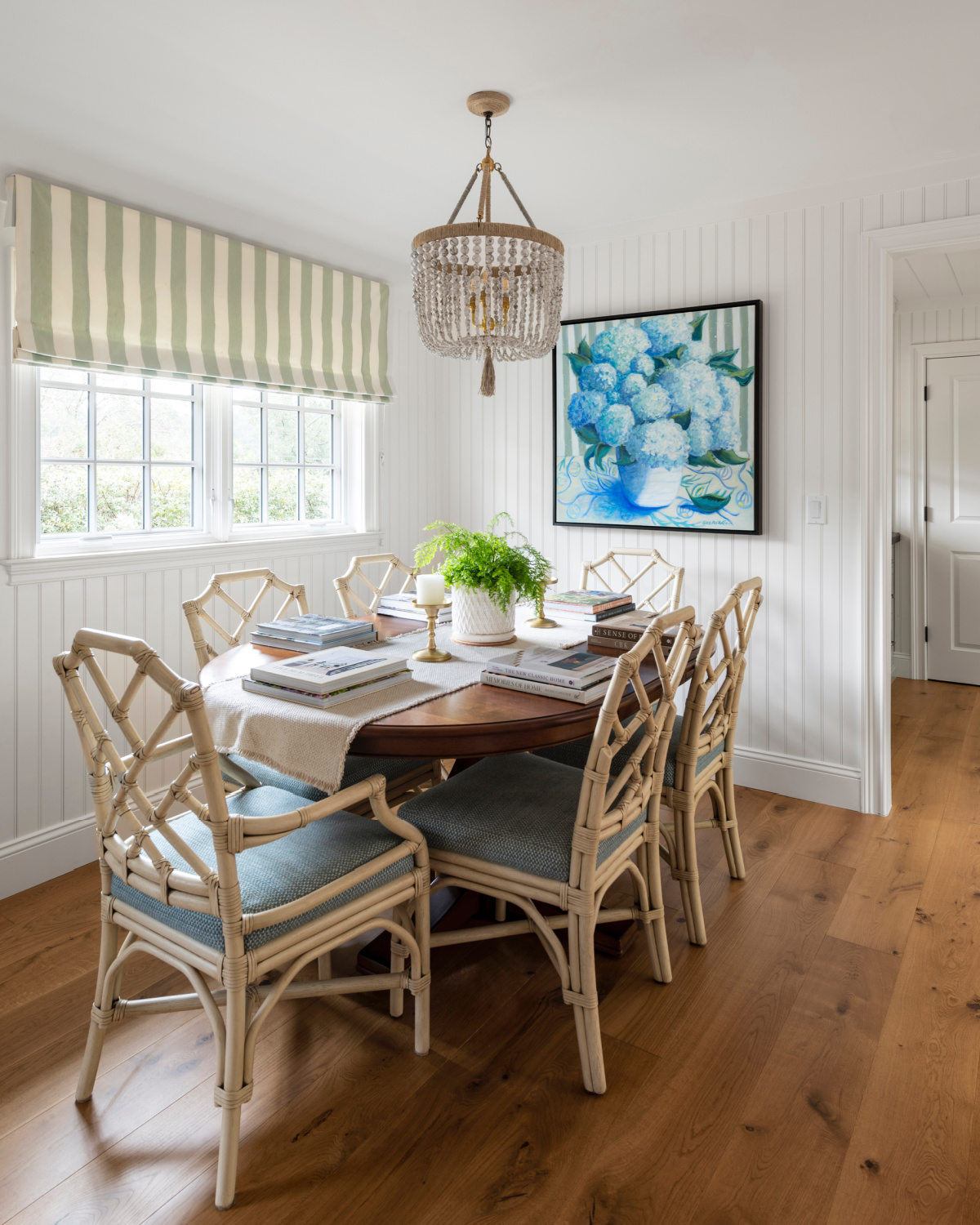 Dining table decorated with books.