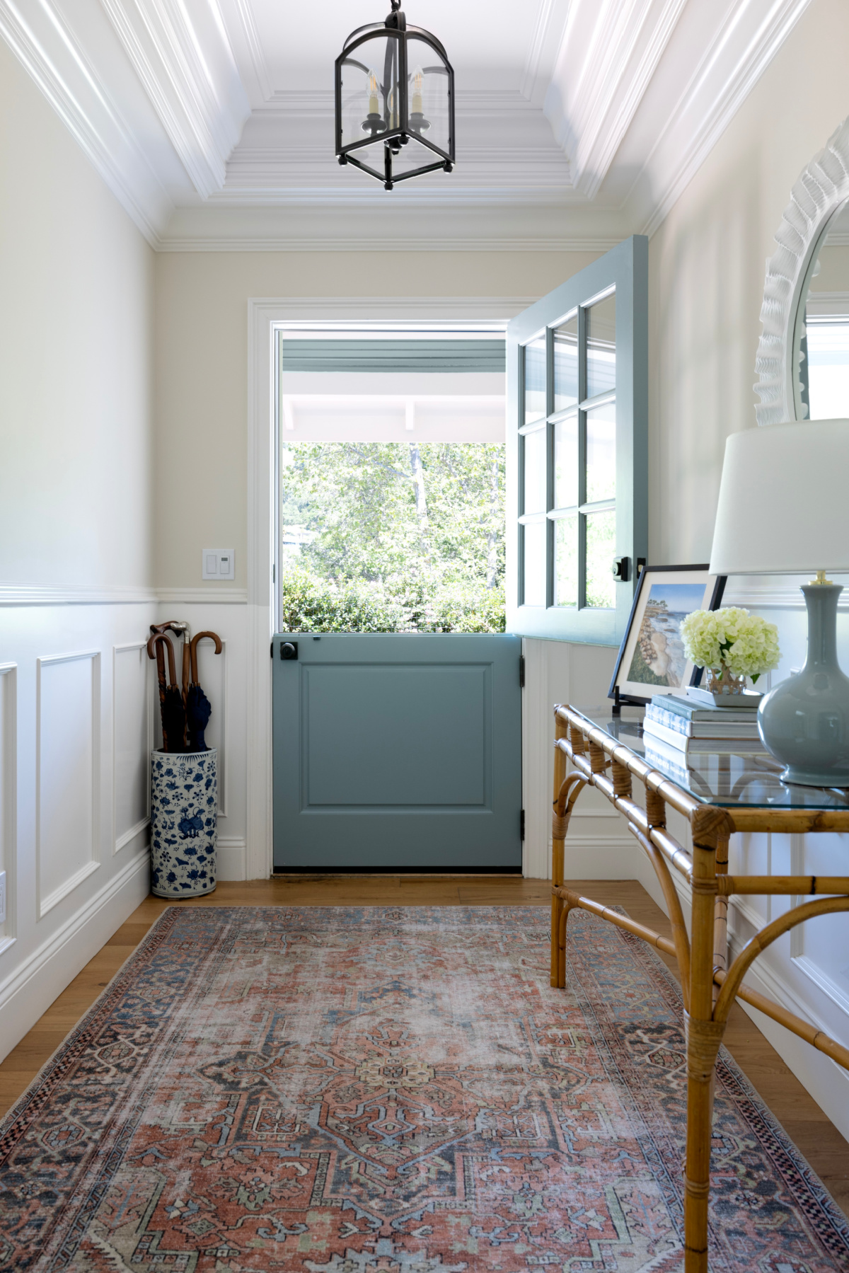 Home foyer with opened blue Dutch door.