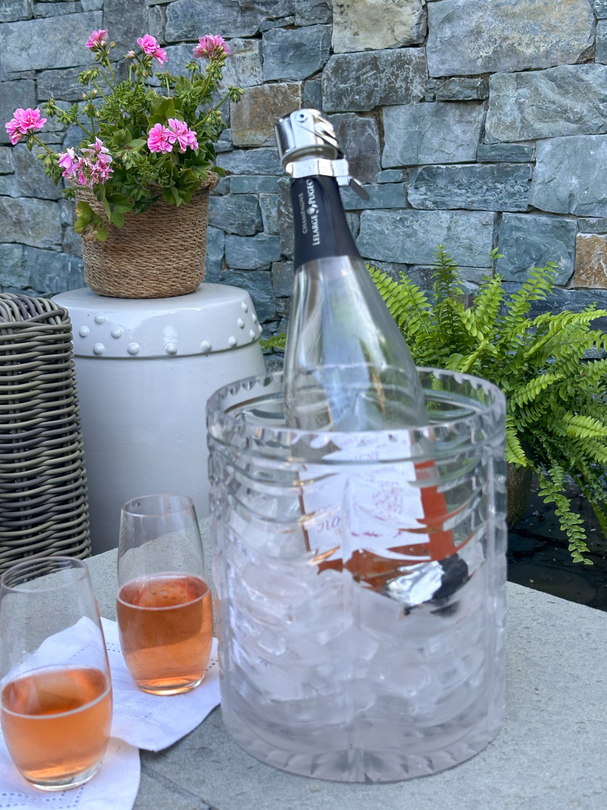 Bucket of rose champagne and two glasses.