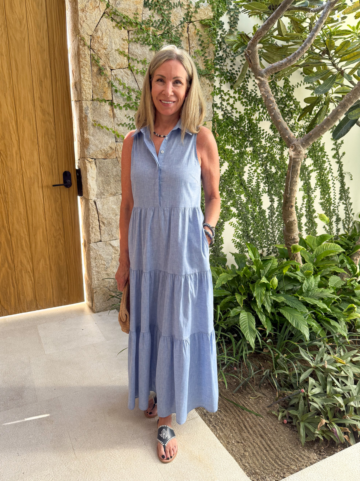 Woman wearing blue tiered dress in Cabo.