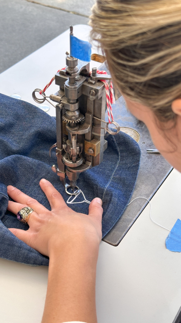 Woman trying on Frank & Eileen Gabi pullover.