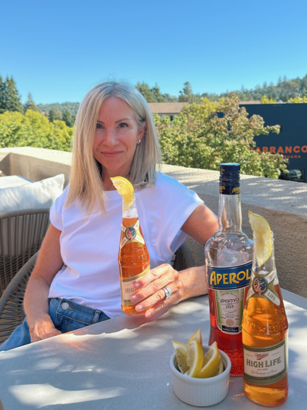 Woman holding Spaghatt Cocktail aka Trailer Park Spritz.