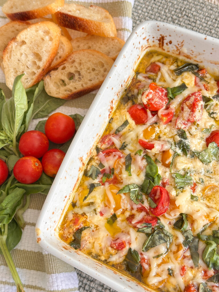 Caprese Dip and toasted baguette slices.