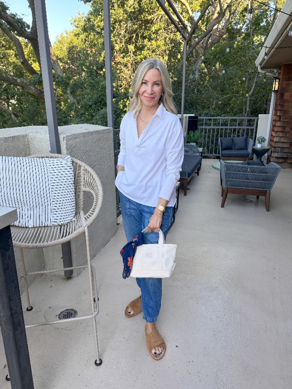 Woman holding boat and tote mini.
