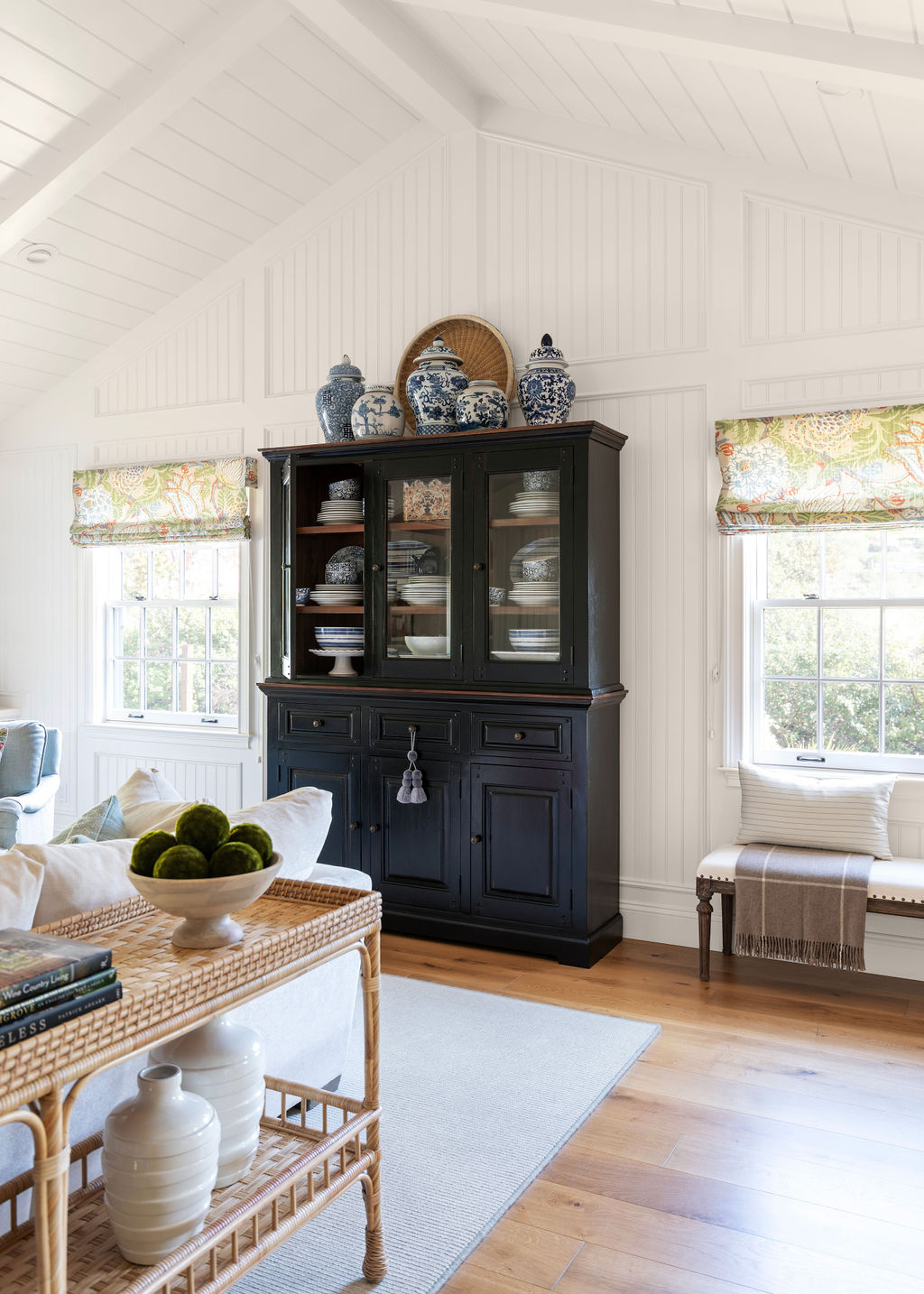 Great room with black hutch.