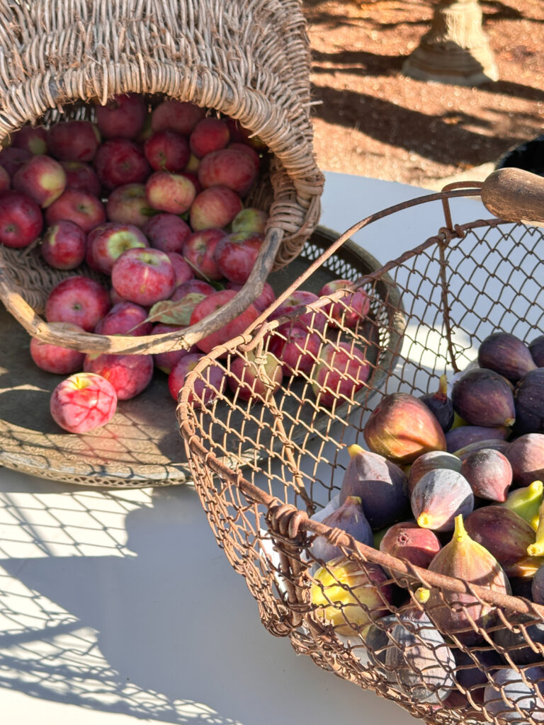 Baskets of apples and figs.