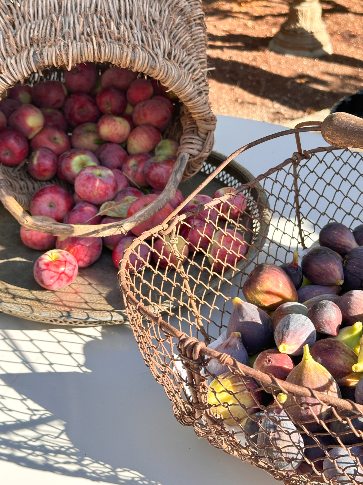 Baskets of apples and figs.