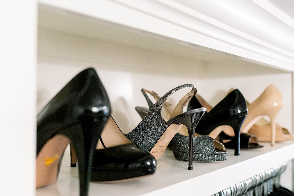 Designer shoes in closet.